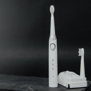 Electric toothbrush with charging station